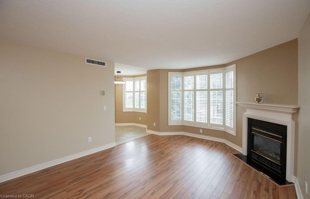 202-990 Golf Links Road, Hamilton, ON - Indoor Photo Showing Living Room With Fireplace