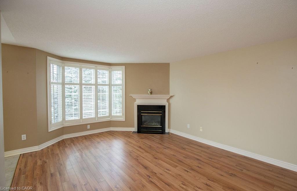 202-990 Golf Links Road, Hamilton, ON - Indoor Photo Showing Living Room With Fireplace