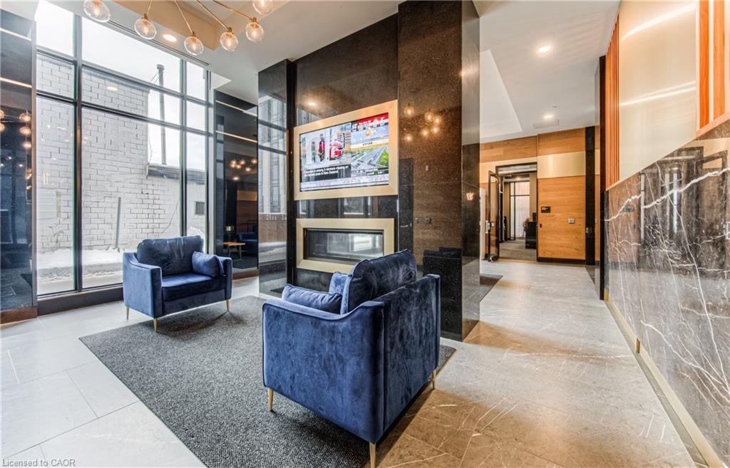 1210-145 Columbia Street W, Waterloo, ON - Indoor Photo Showing Other Room With Fireplace
