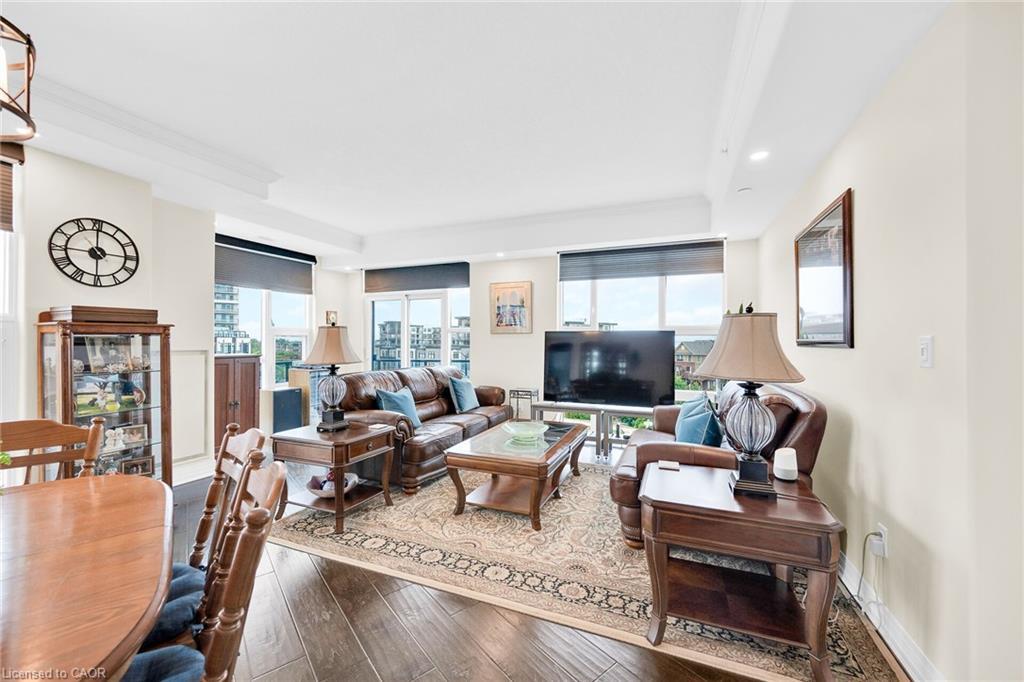 408-10 Concord Place, Grimsby, ON - Indoor Photo Showing Living Room With Fireplace