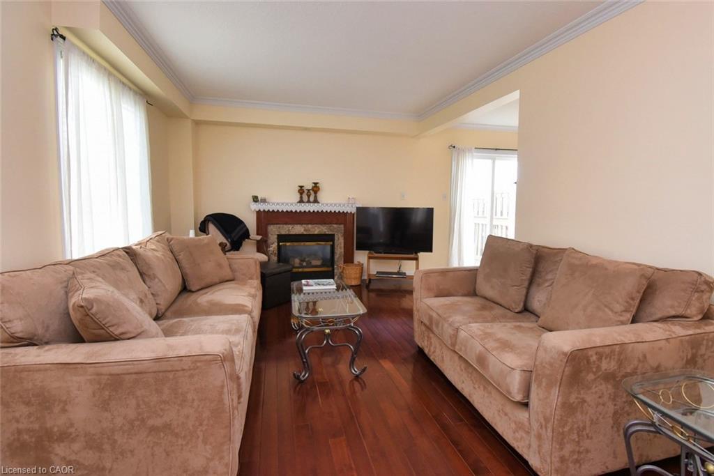 49-7 Southside Place, Hamilton, ON - Indoor Photo Showing Living Room With Fireplace
