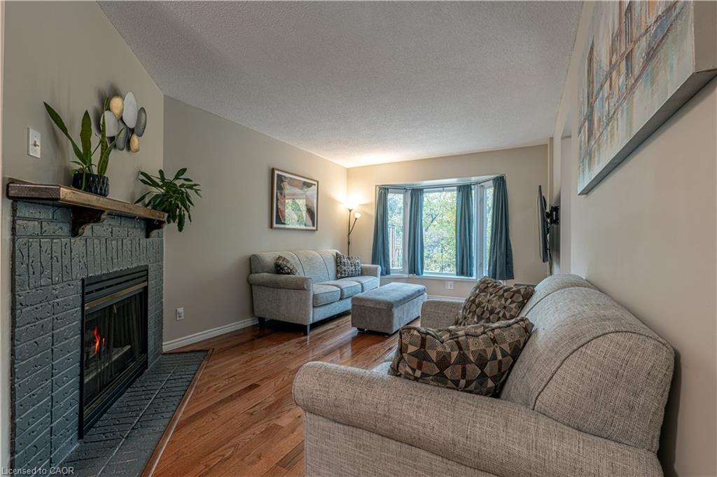 13-2230 Walkers Line, Burlington, ON - Indoor Photo Showing Living Room With Fireplace