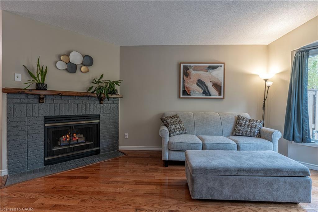 13-2230 Walkers Line, Burlington, ON - Indoor Photo Showing Living Room With Fireplace
