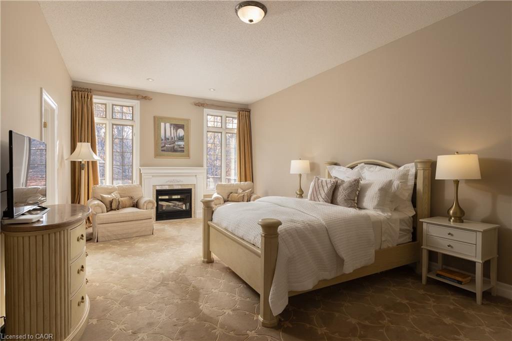1285 Beaufort Drive, Burlington, ON - Indoor Photo Showing Bedroom With Fireplace