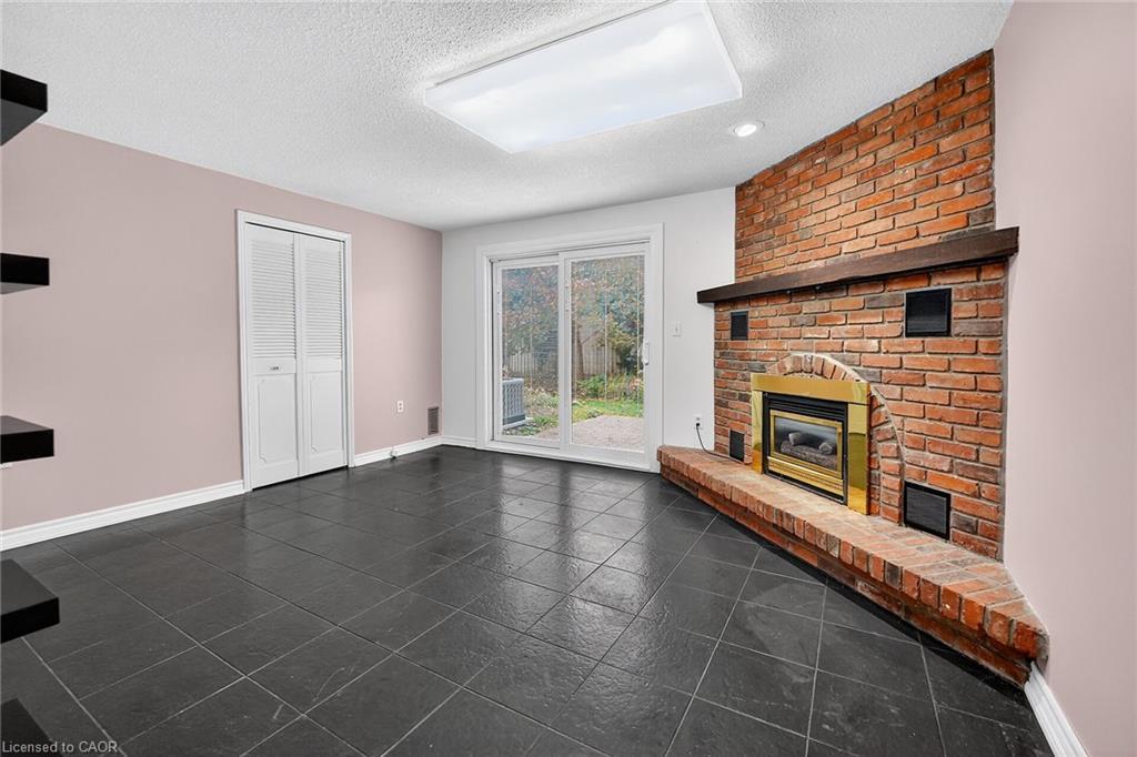 21-178 Scott Street, St. Catharines, ON - Indoor With Fireplace