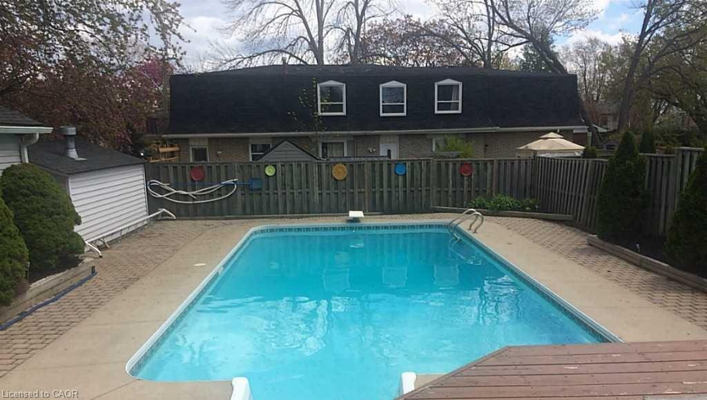 2232 Queensway Street, Burlington, ON - Outdoor With In Ground Pool With Backyard