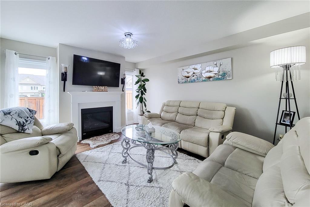 76 Mcallistar Drive, Binbrook, ON - Indoor Photo Showing Living Room With Fireplace