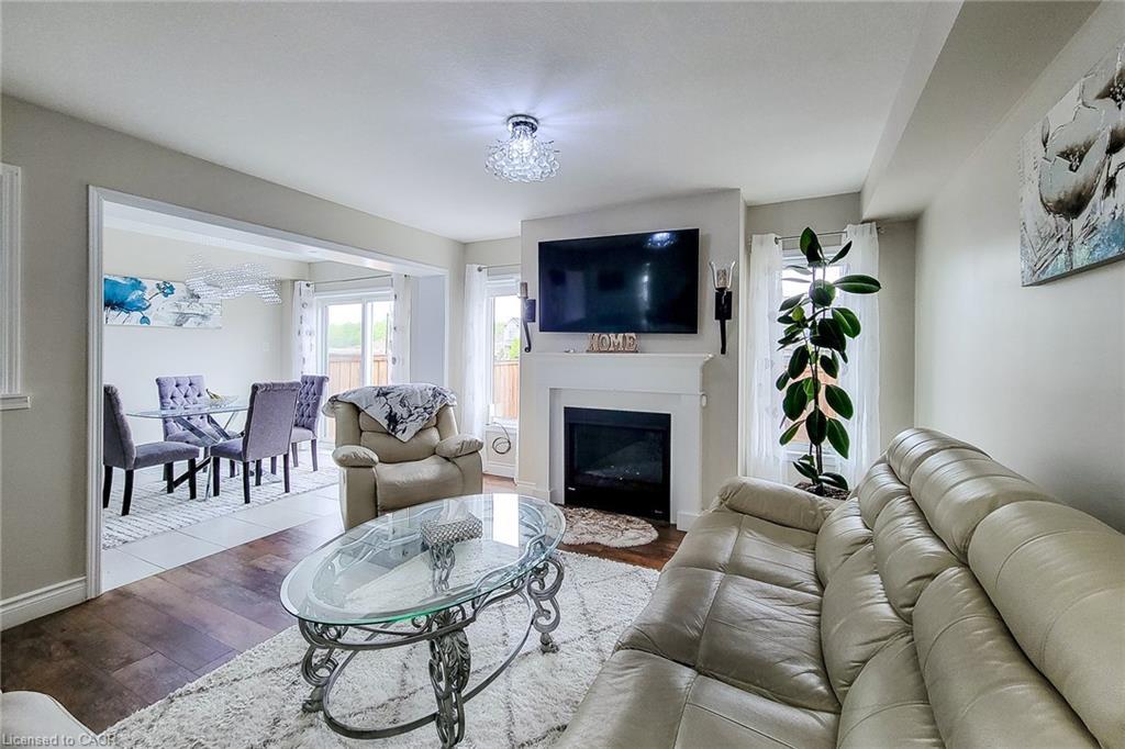 76 Mcallistar Drive, Binbrook, ON - Indoor Photo Showing Living Room With Fireplace