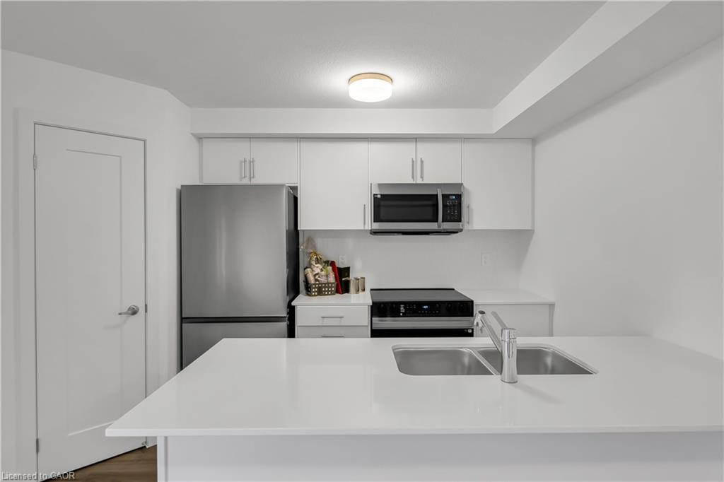 81-940 David Street, Wellington, ON - Indoor Photo Showing Kitchen With Double Sink