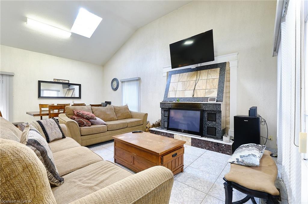 13 Balsam Avenue, Woodland Beach, ON - Indoor Photo Showing Living Room With Fireplace