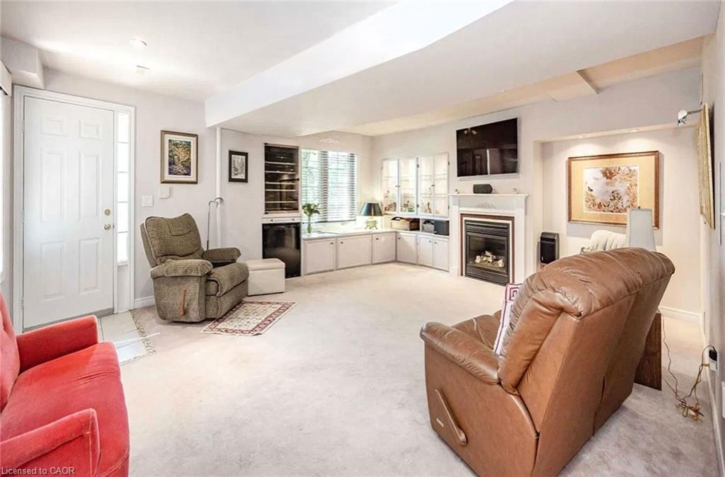 4-2871 Darien Road, Burlington, ON - Indoor Photo Showing Living Room With Fireplace