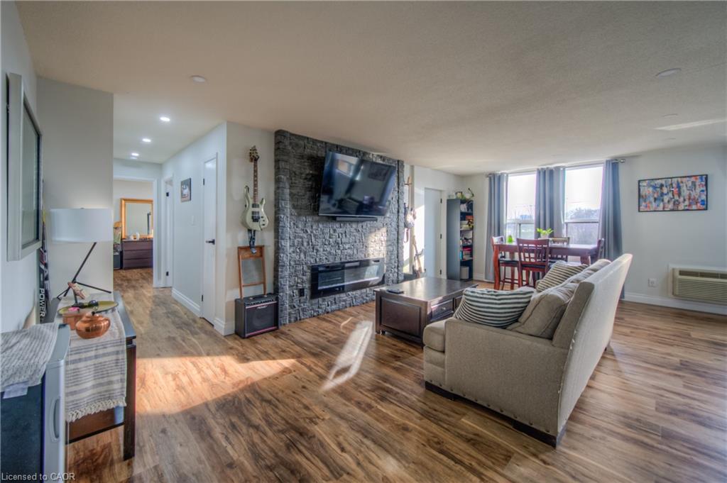 410-185 Kehl Street, Kitchener, ON - Indoor Photo Showing Living Room With Fireplace