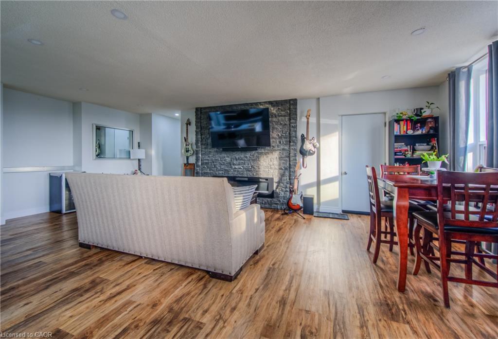 410-185 Kehl Street, Kitchener, ON - Indoor Photo Showing Living Room With Fireplace