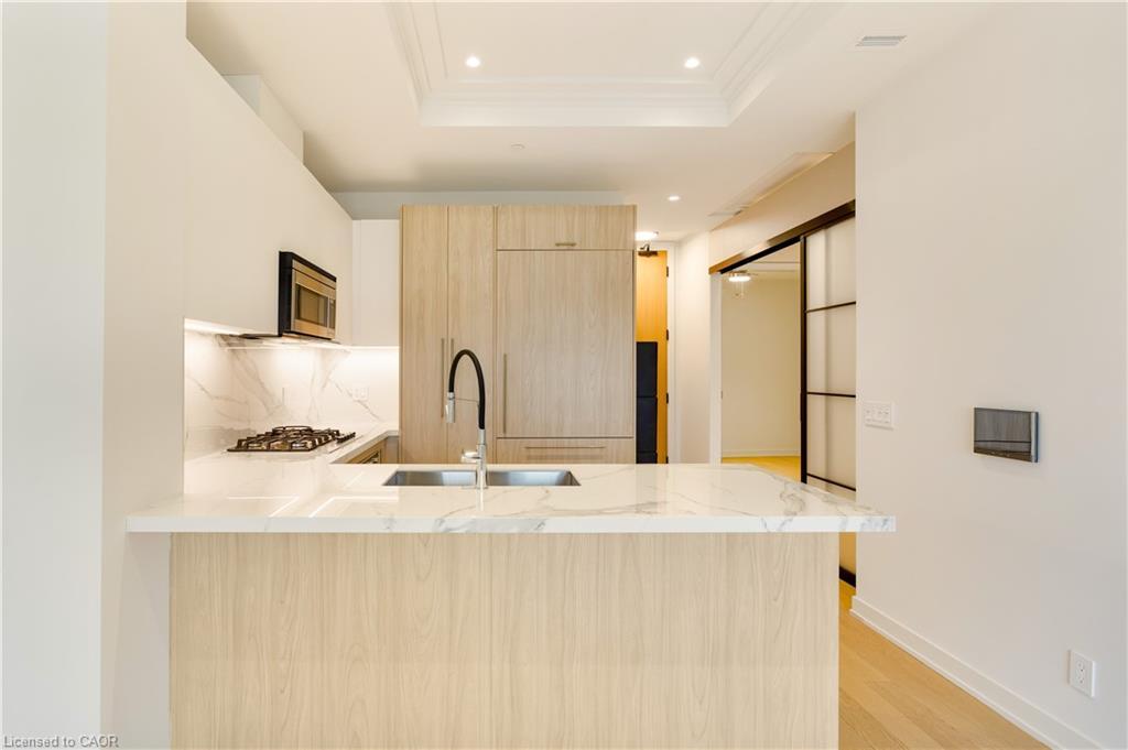 307-123 Maurice Drive, Oakville, ON - Indoor Photo Showing Kitchen With Double Sink