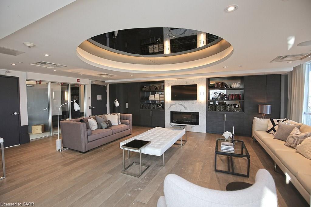 108-10 Concord Place, Grimsby, ON - Indoor Photo Showing Living Room With Fireplace