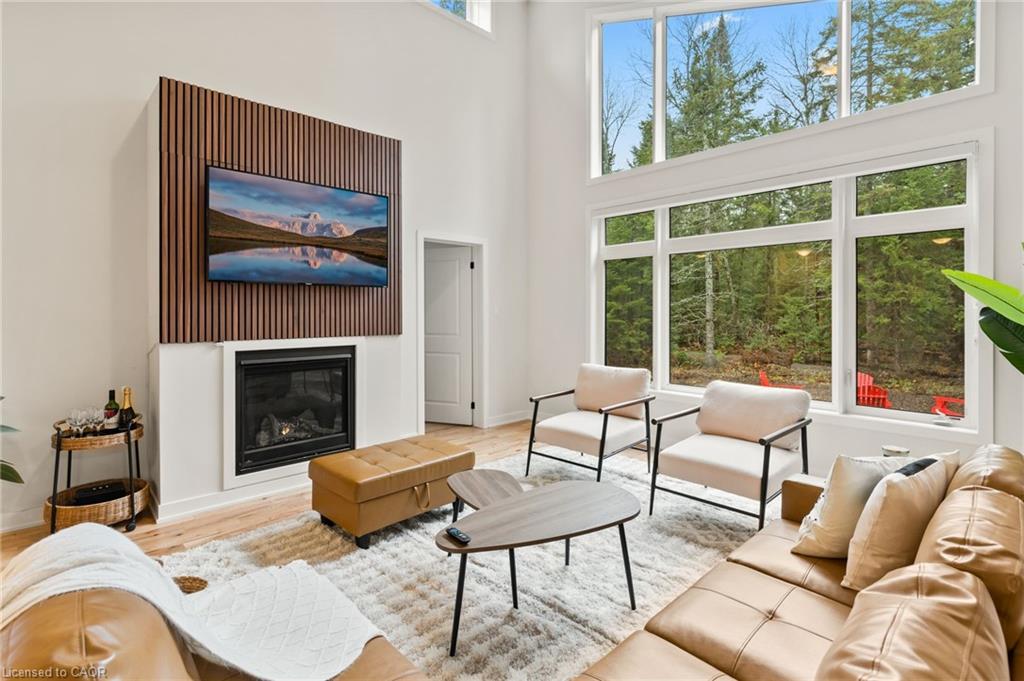 1049 Greensview Drive, Huntsville, ON - Indoor Photo Showing Living Room With Fireplace