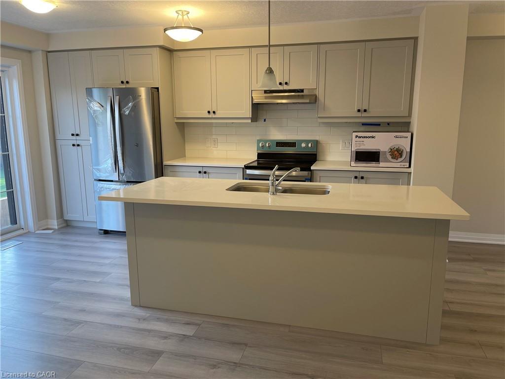 3-311 Woolwich Street, Waterloo, ON - Indoor Photo Showing Kitchen With Double Sink