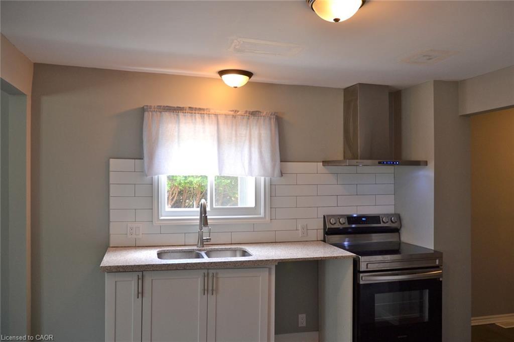 404 Queensway W, Simcoe, ON - Indoor Photo Showing Kitchen With Double Sink