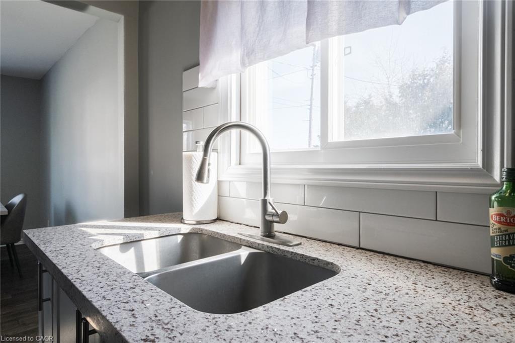 404 Queensway W, Simcoe, ON - Indoor Photo Showing Kitchen With Double Sink