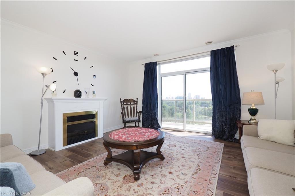 701-255 Keats Way, Waterloo, ON - Indoor Photo Showing Living Room With Fireplace