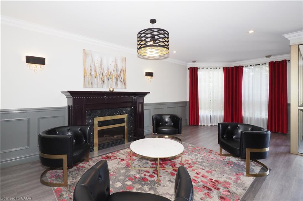 701-255 Keats Way, Waterloo, ON - Indoor Photo Showing Living Room With Fireplace