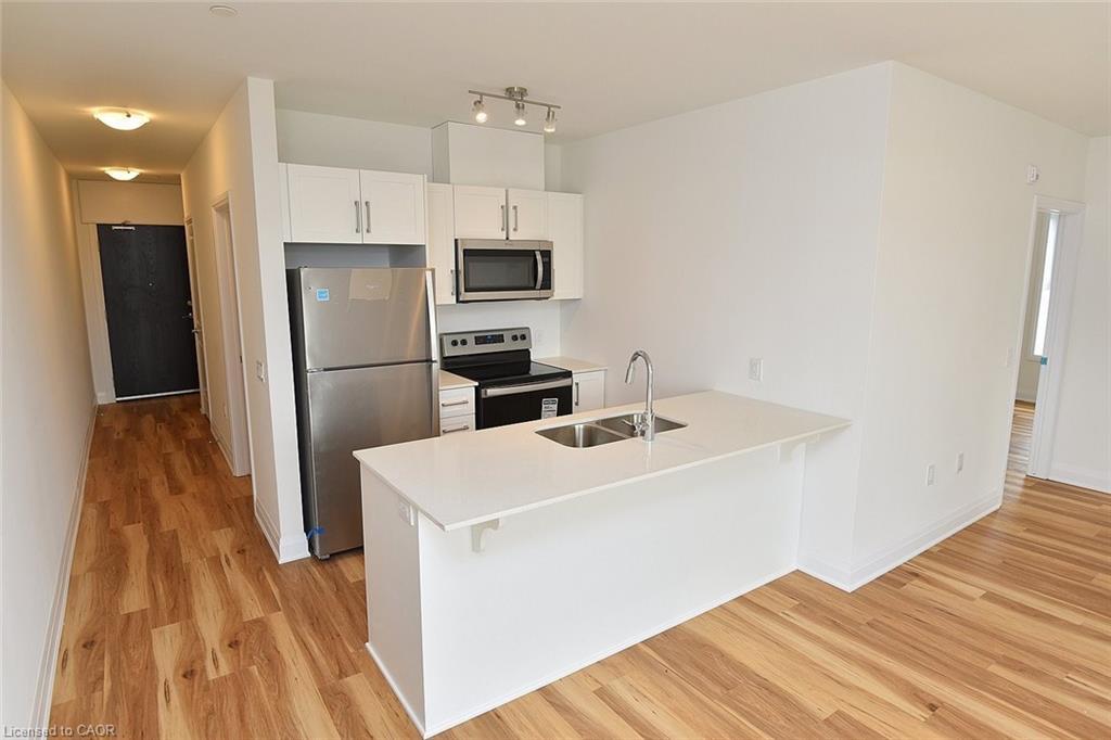 219-1936 Rymal Road E, Hamilton, ON - Indoor Photo Showing Kitchen With Stainless Steel Kitchen With Double Sink