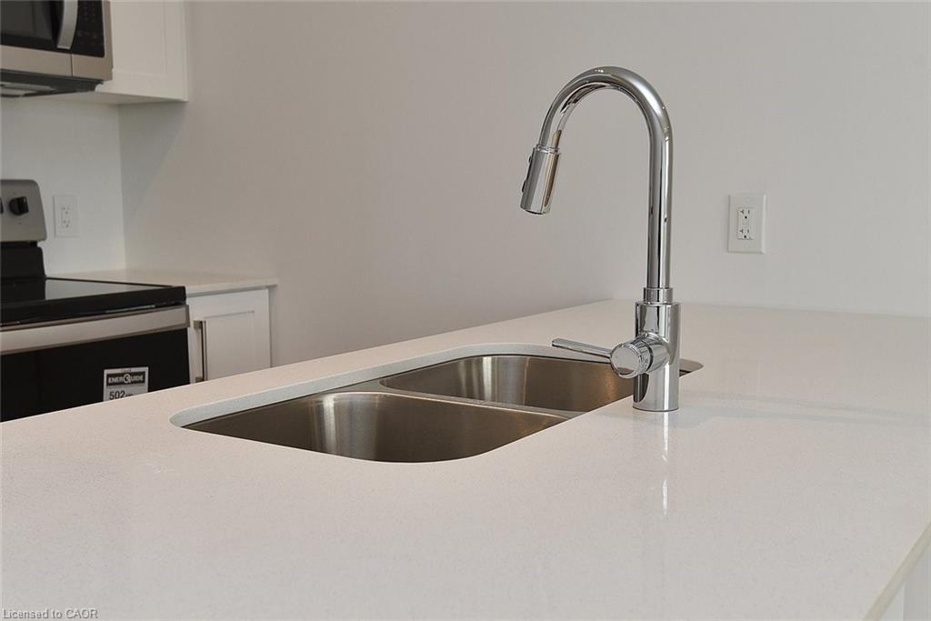 219-1936 Rymal Road E, Hamilton, ON - Indoor Photo Showing Kitchen With Double Sink