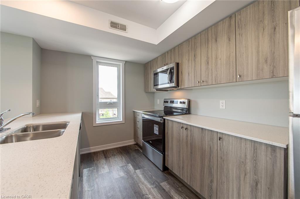 A7-1331 Countrystone Drive, Kitchener, ON - Indoor Photo Showing Kitchen With Double Sink