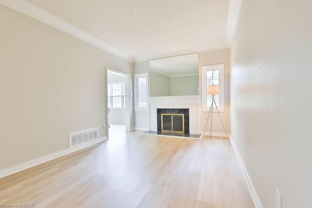 11-4211 Millcroft Park Drive, Burlington, ON - Indoor Photo Showing Living Room With Fireplace