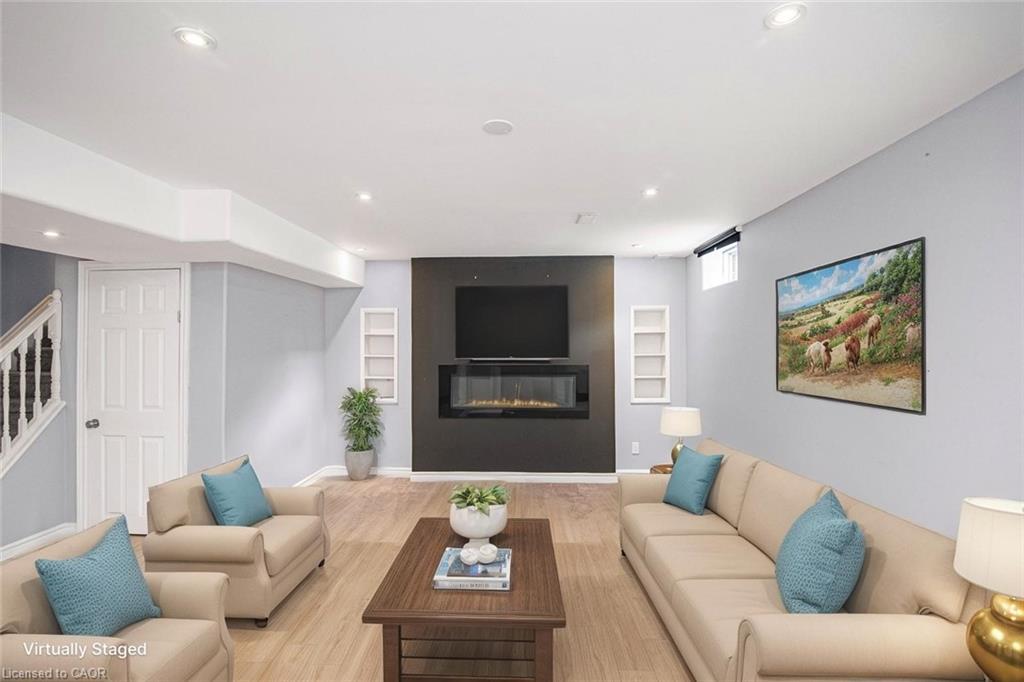 23-222 Fall Fair Way, Binbrook, ON - Indoor Photo Showing Living Room With Fireplace