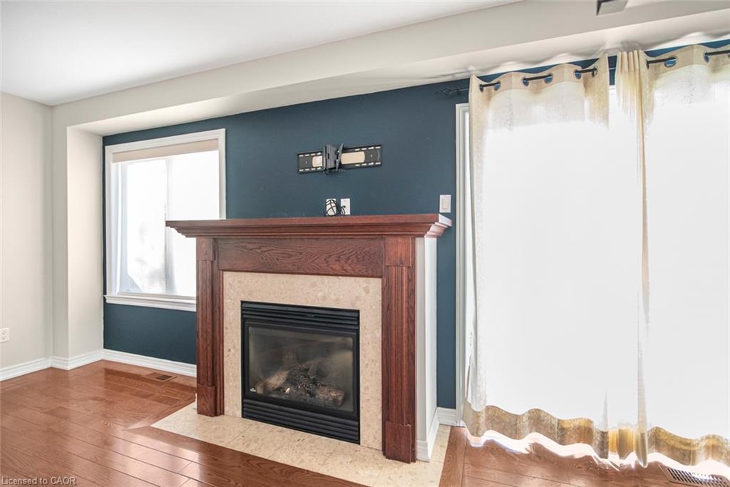 23-222 Fall Fair Way, Binbrook, ON - Indoor Photo Showing Living Room With Fireplace