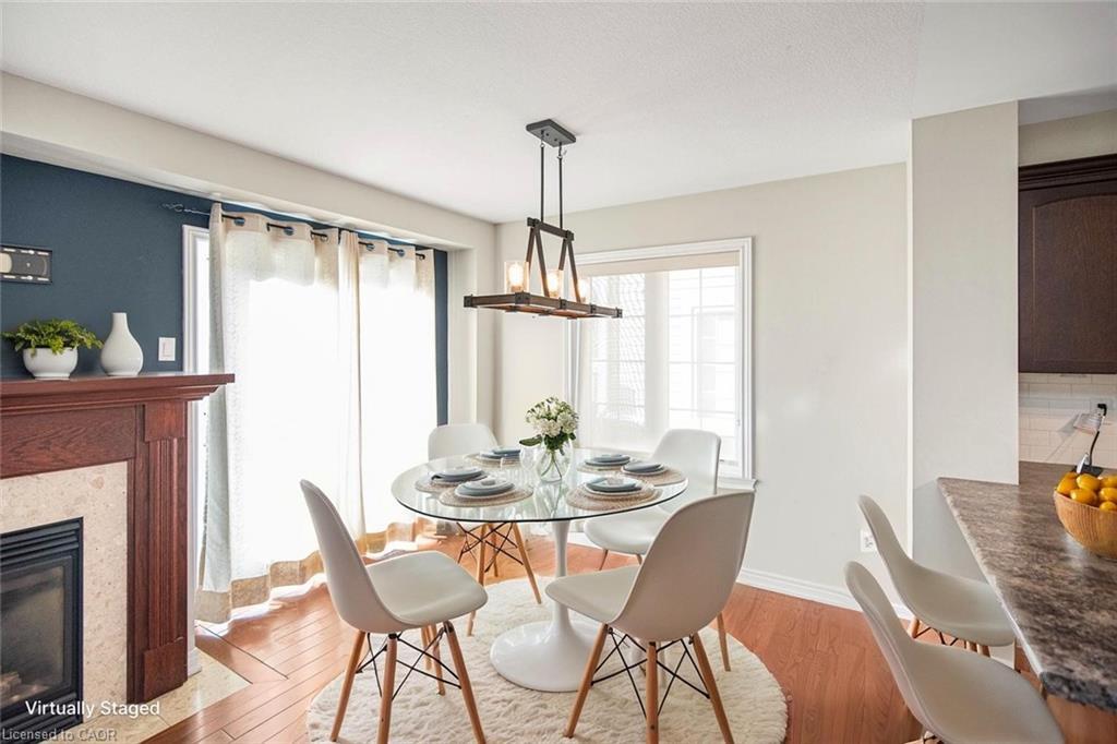 23-222 Fall Fair Way, Binbrook, ON - Indoor Photo Showing Dining Room With Fireplace
