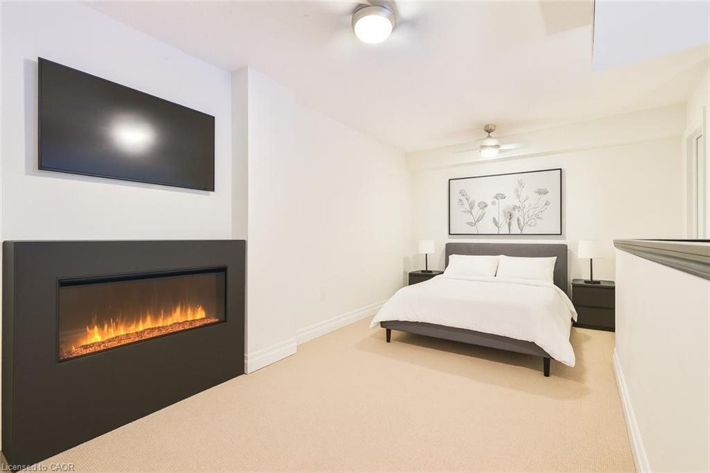 404-185 Robinson Street, Oakville, ON - Indoor Photo Showing Bedroom With Fireplace