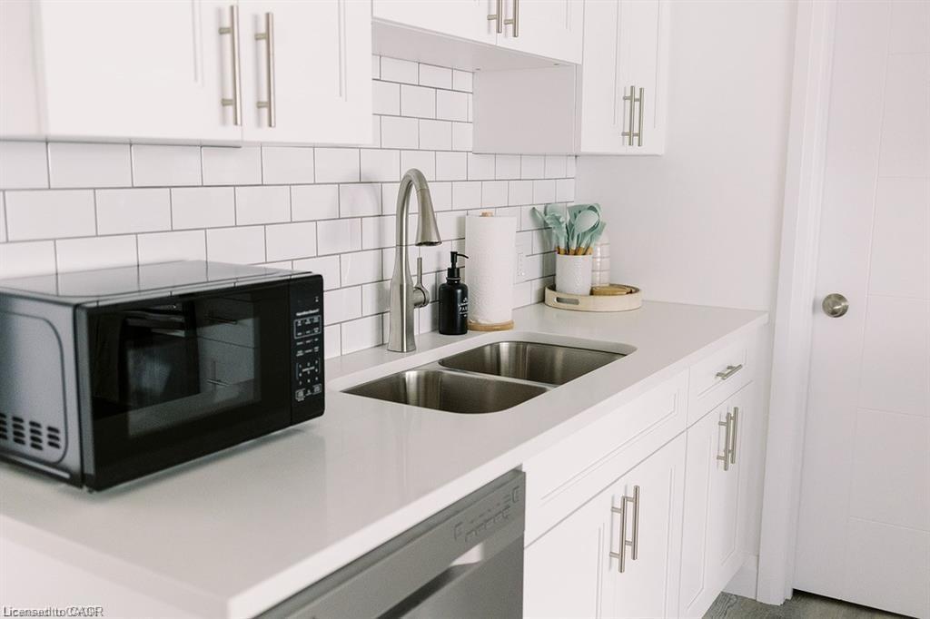 B-261 Belmont Avenue W, Kitchener, ON - Indoor Photo Showing Kitchen With Double Sink