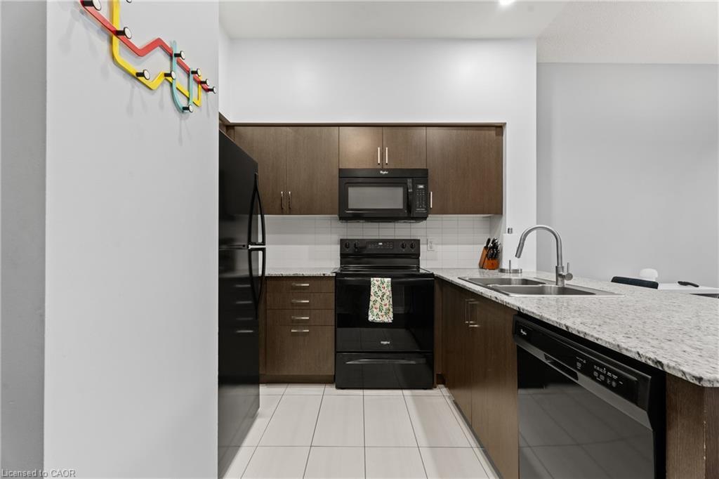 104-80 Esther Lorrie Drive, Toronto, ON - Indoor Photo Showing Kitchen With Double Sink