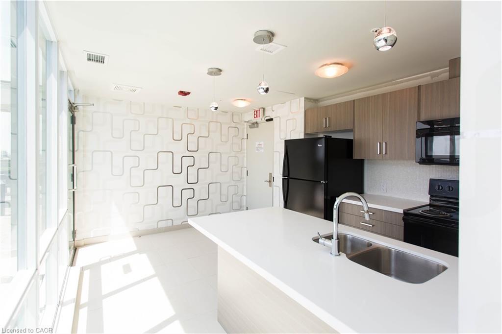 104-80 Esther Lorrie Drive, Toronto, ON - Indoor Photo Showing Kitchen With Double Sink