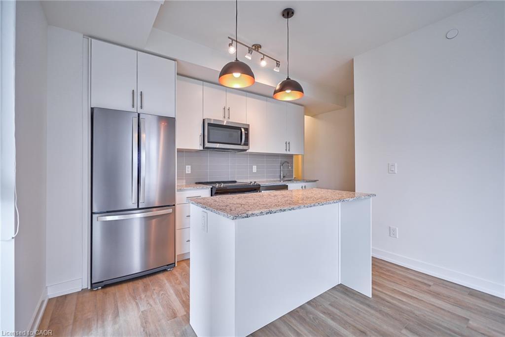 403-345 Wheat Boom Drive, Oakville, ON - Indoor Photo Showing Kitchen With Upgraded Kitchen