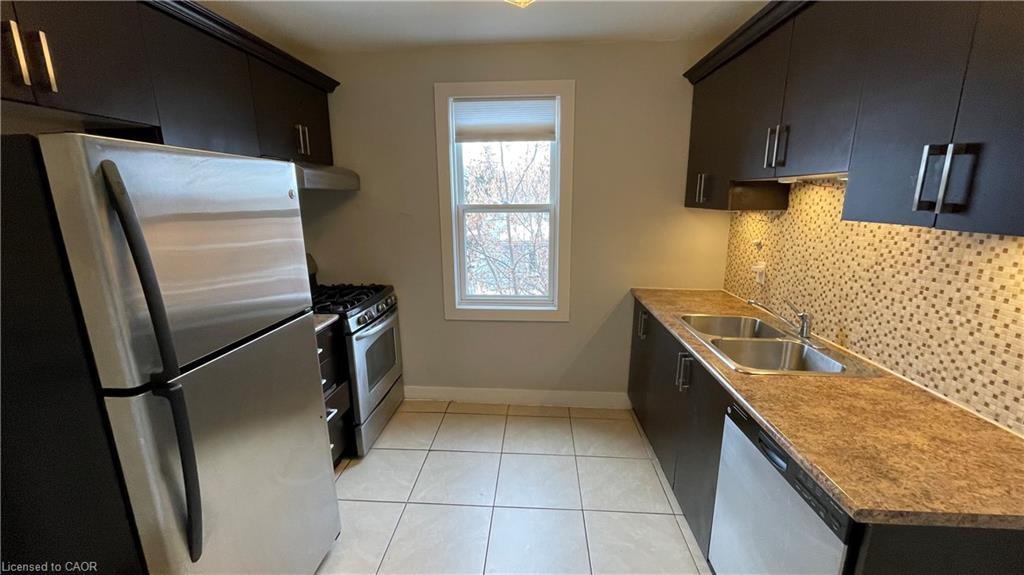406-1544 King Street E, Hamilton, ON - Indoor Photo Showing Kitchen With Double Sink