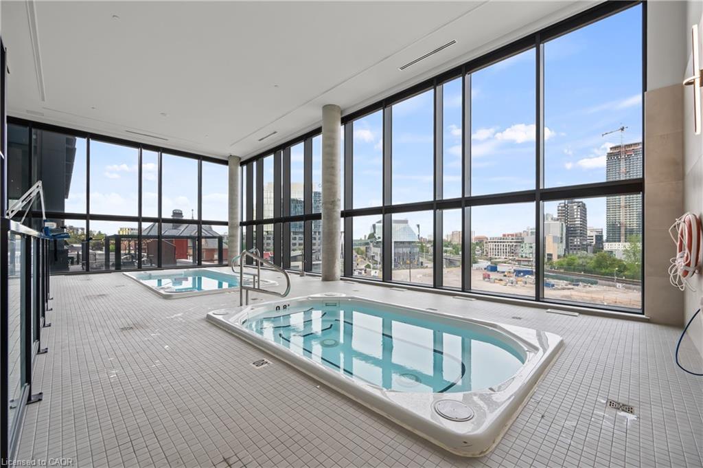 907-25 Wellington Street S, Kitchener, ON - Indoor Photo Showing Other Room With In Ground Pool