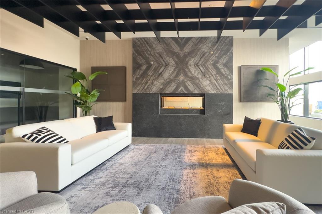 501-8020 Derry Road, Milton, ON - Indoor Photo Showing Living Room With Fireplace