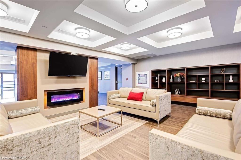 1011-150 Main Street W, Hamilton, ON - Indoor Photo Showing Living Room With Fireplace