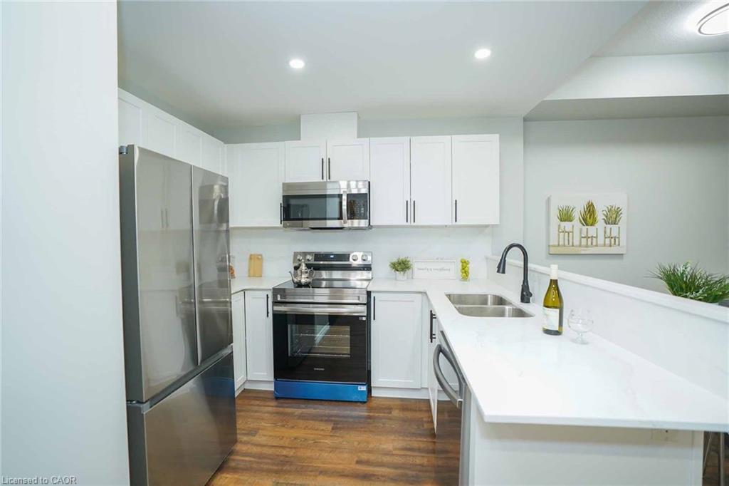 107-7 Kay Crescent, Guelph, ON - Indoor Photo Showing Kitchen With Double Sink