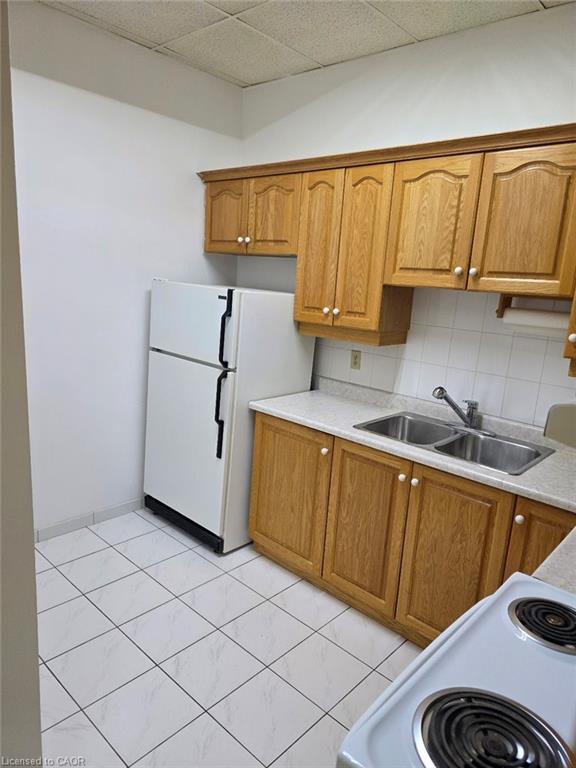 135 Logan Avenue, Toronto, ON - Indoor Photo Showing Kitchen With Double Sink