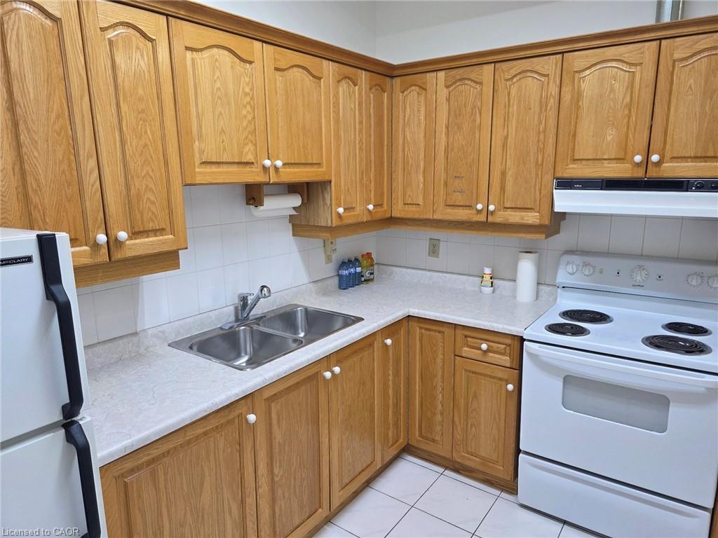 135 Logan Avenue, Toronto, ON - Indoor Photo Showing Kitchen With Double Sink