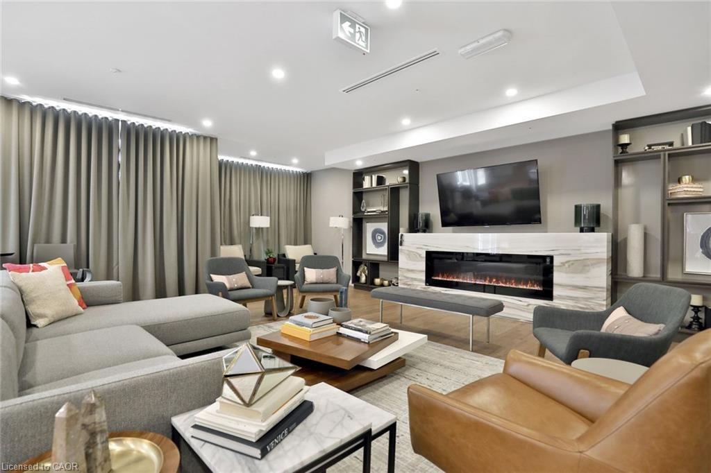 105-457 Plains Road E, Burlington, ON - Indoor Photo Showing Living Room With Fireplace