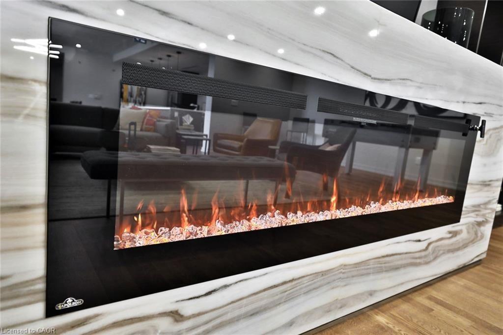 105-457 Plains Road E, Burlington, ON - Indoor Photo Showing Other Room With Fireplace