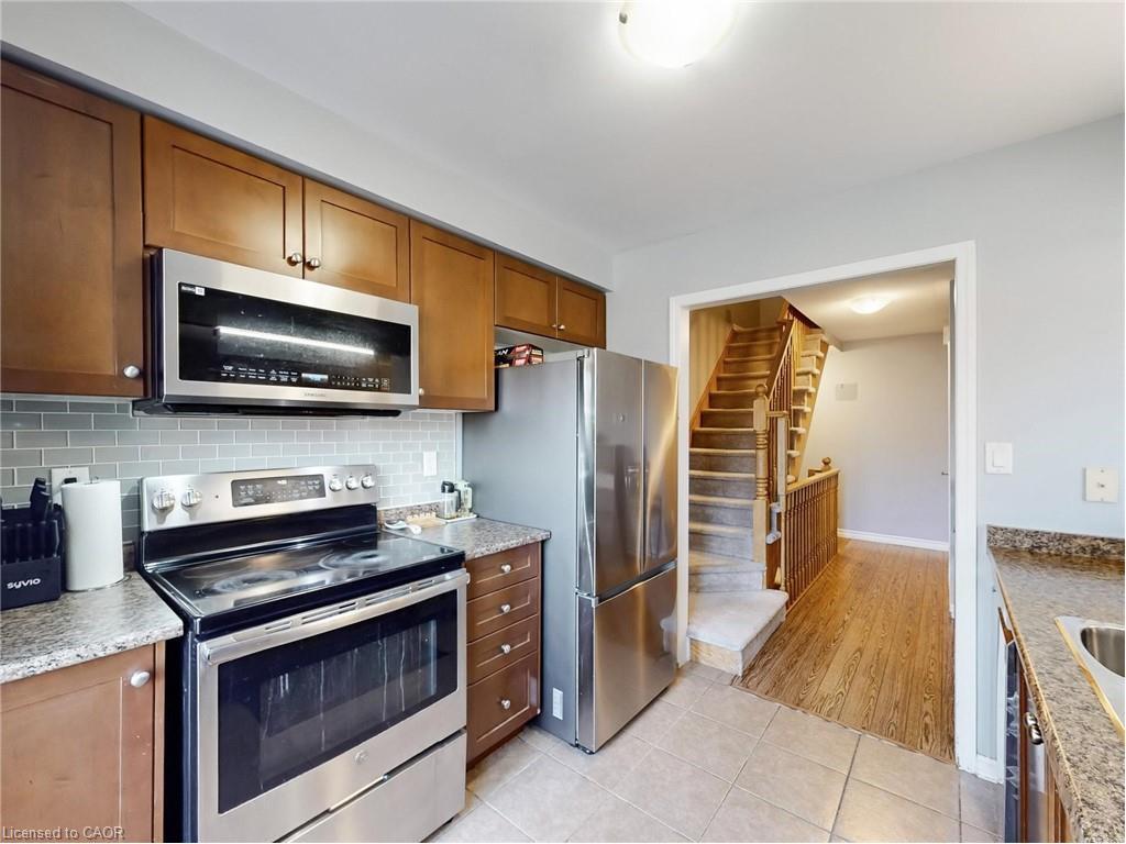 597 Speyer Circle, Milton, ON - Indoor Photo Showing Kitchen With Double Sink