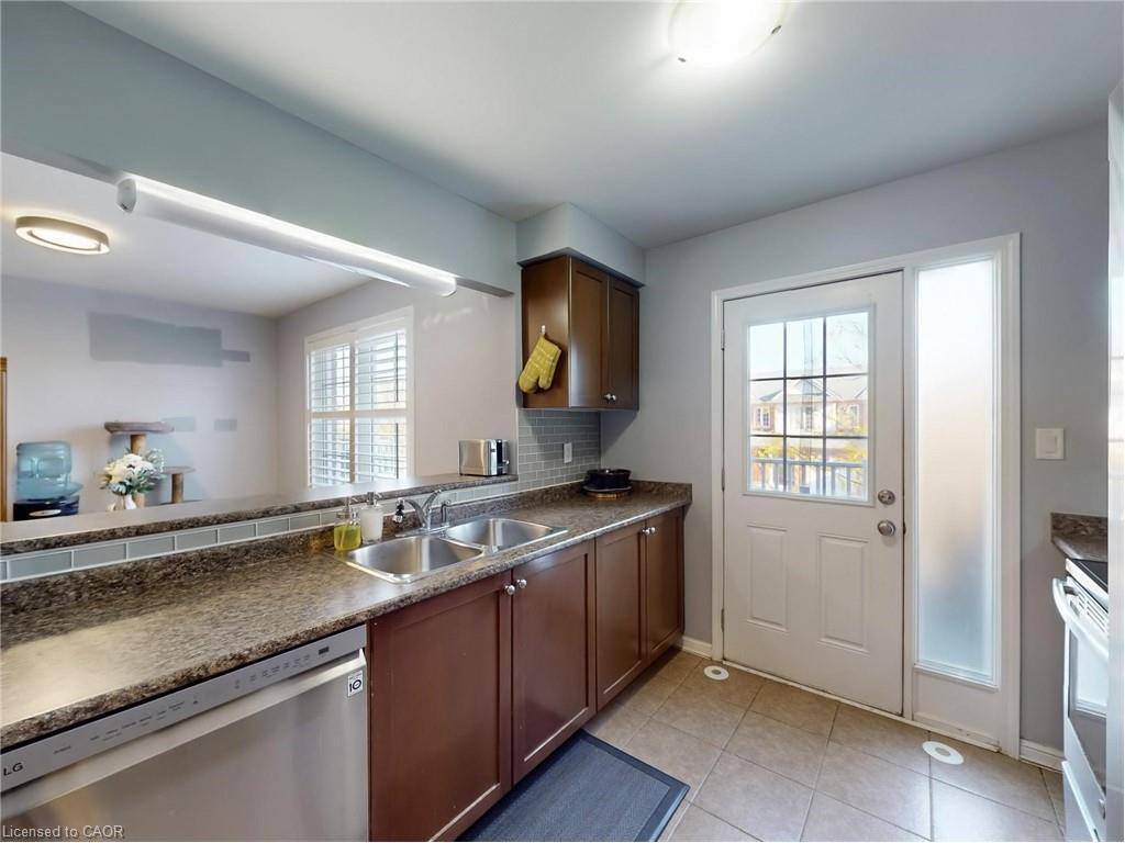 597 Speyer Circle, Milton, ON - Indoor Photo Showing Kitchen With Double Sink