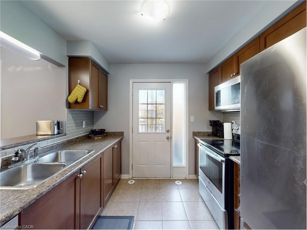 597 Speyer Circle, Milton, ON - Indoor Photo Showing Kitchen With Double Sink