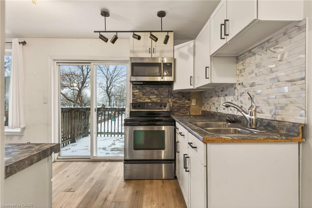218 East 8Th Street, Hamilton, ON - Indoor Photo Showing Kitchen With Double Sink